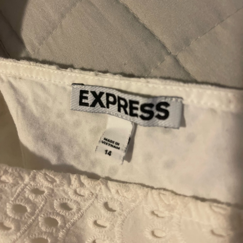 Express white, laced romper with a tie back